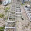 2 Ext ladders w slight bends