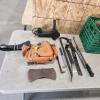 Assorted pry bars, grinder, etc.