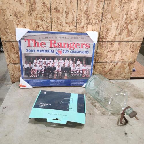 Glass jug, bathroom faucet, rangers poster
