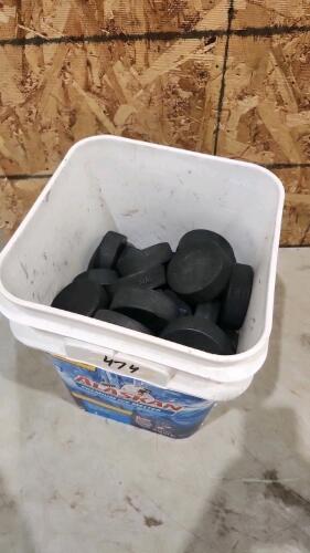 Bucket of hockey pucks