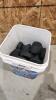 Bucket of hockey pucks