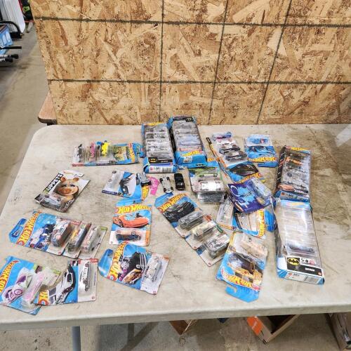 Various hotwheels toys, packages got wet