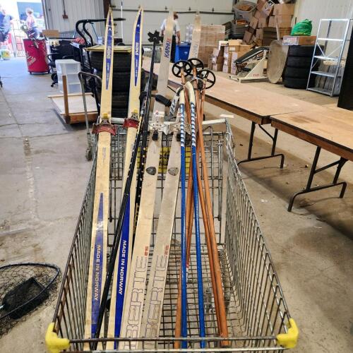 2 sets of skiis w 4 poles