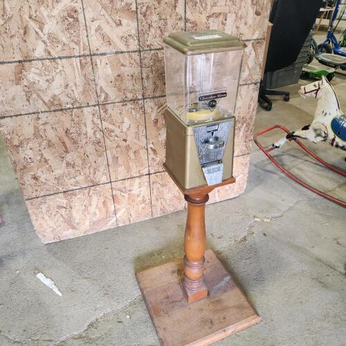 Coin operated candy dispenser