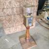 Coin operated candy dispenser
