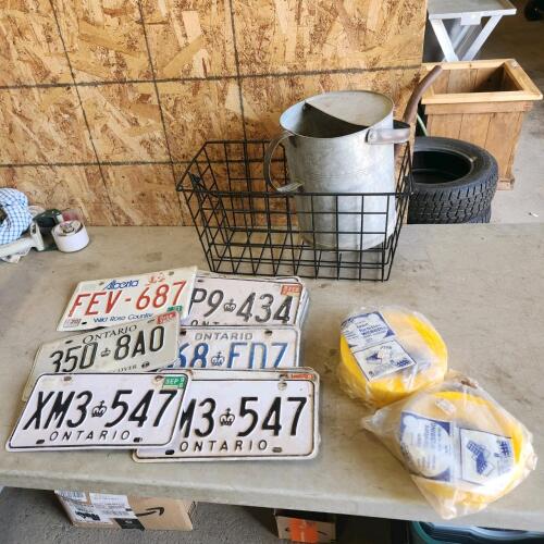 Lawn chair webbing, watering can, license plates