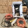 Various sized plastic plumbing fittings, cord, trouble light