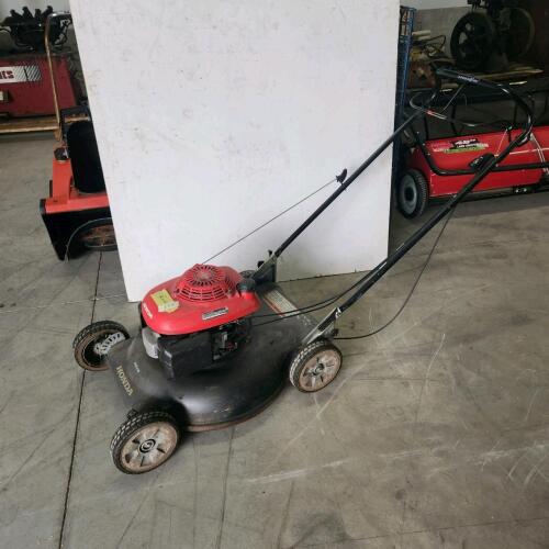 Running Honda self propelled mower