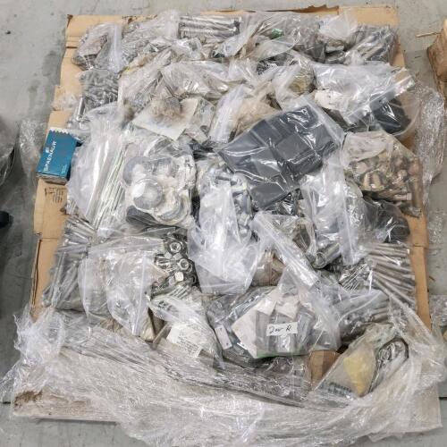 Skid of various sized nuts, bolts, hinges, etc.