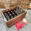 Coca-Cola crate w empty and full bottles