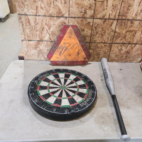 Alum bat, dart board, sign
