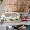 4 Ton jack, garden hose, axe