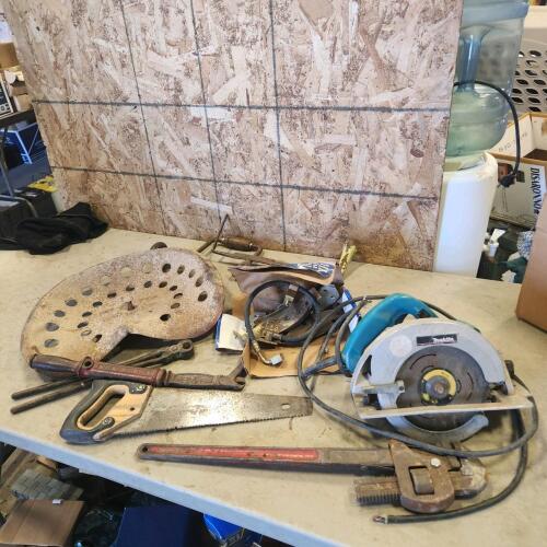 Tractor seat, pipe wrench, etc.