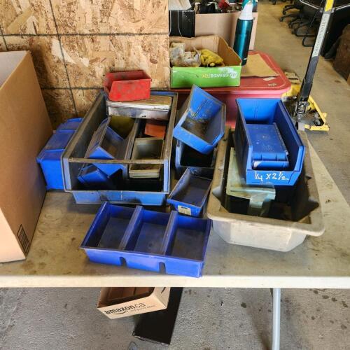 Various sized plastic bins