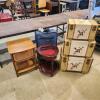 Suitcases, small tables, various sized trunks