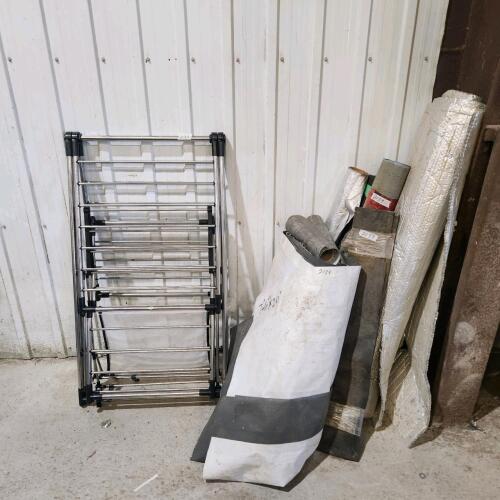 Rolls of roofing membrane, tar paper, drying rack, etc.