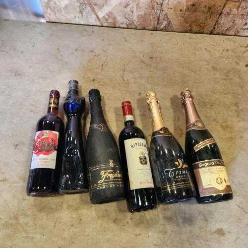 Various sealed bottles of wine
