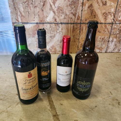 Various sealed bottles of wine