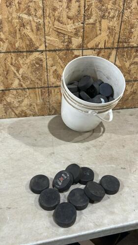 5Gal of hockey pucks