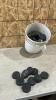 5Gal of hockey pucks